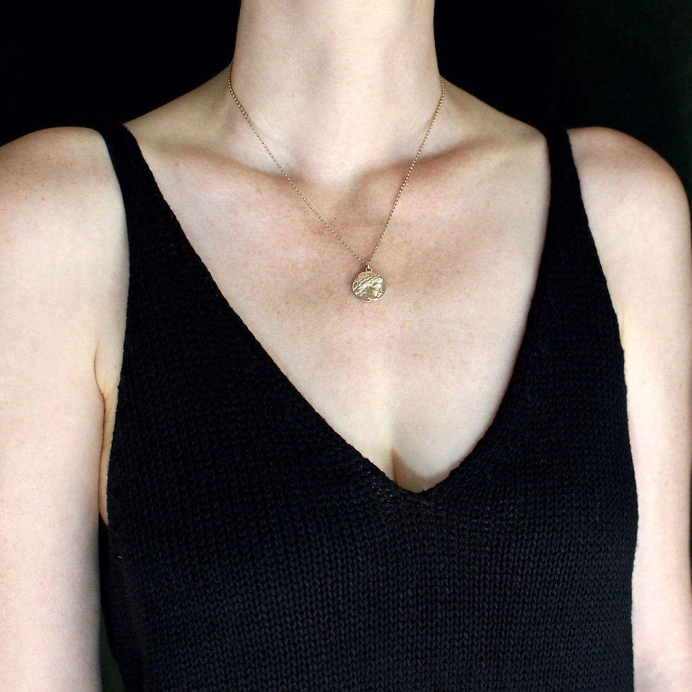 Apollo coin necklace on woman