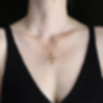 Long thin orthodox cross necklace on woman