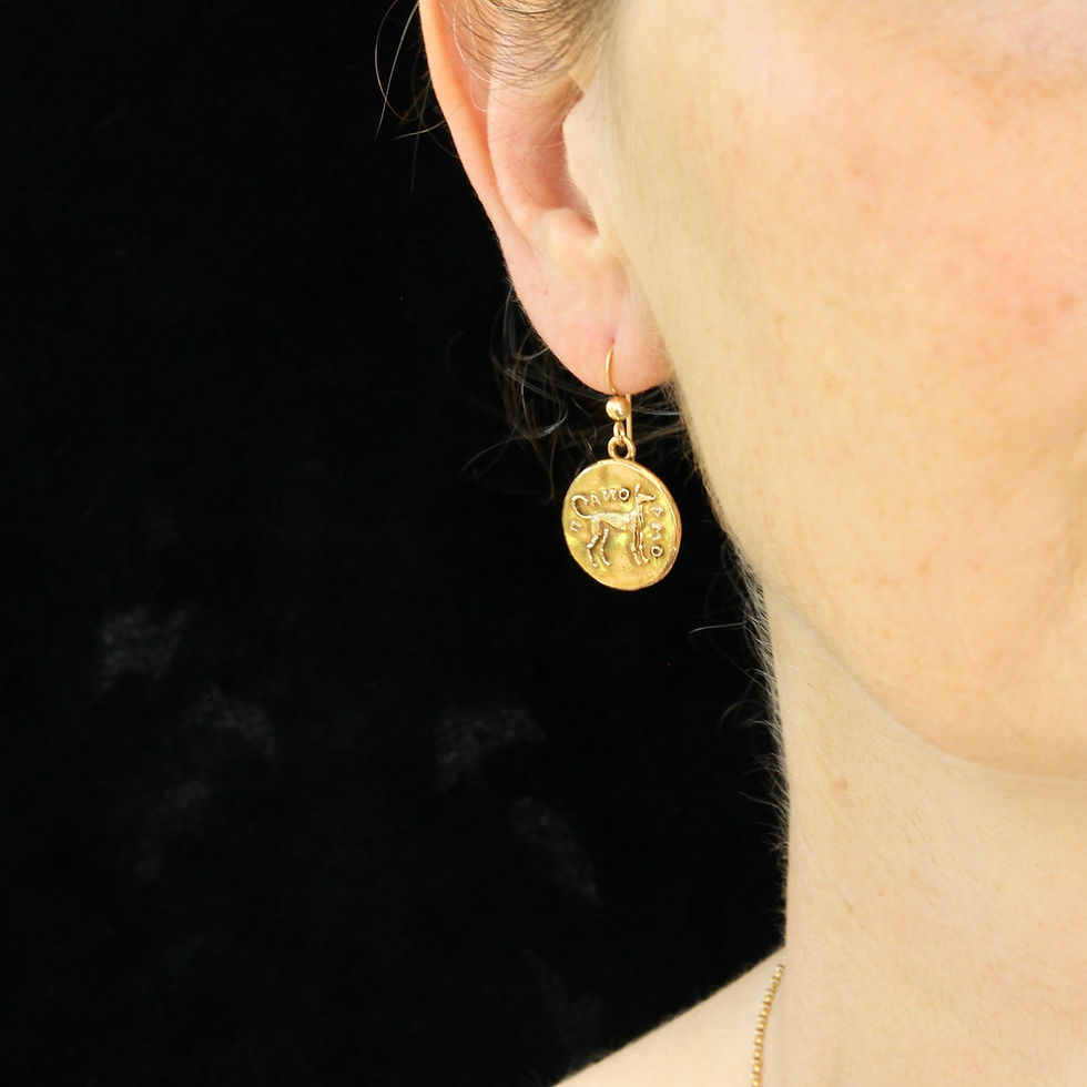 Hound Dog coin earrings on woman