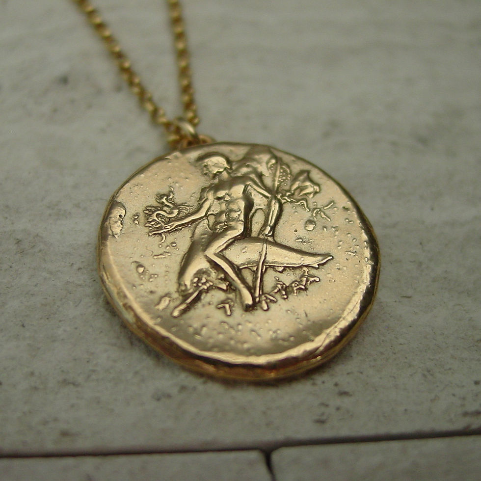 Boy on dolphin coin necklace close up