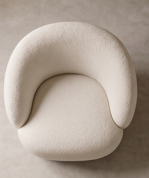 Top view of a round cream bouclé armchair by CASA REALE.