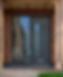 A contemporary door style with bar handle and side light