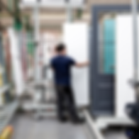 factory worker completing the timber fire doorset manufacturing process