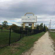 A picture of wrought iron fencing at the boundary of a hotel