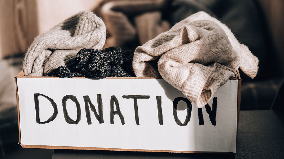 Cardboard box of clothes labelled "Donation"