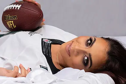 A confident woman poses gracefully with a football, blending boldness and femininity in this empowerment photo captured in Killeen, TX. The soft lighting and relaxed pose create a modern, magazine-style portrait. My Canvas Portraits specializes in helping clients embrace their power and personality through creative photography concepts. Every detail—from lighting to expression—captures empowerment in its purest form. Ideal for clients looking for something unique, expressive, and empowering.