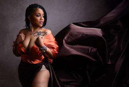 Woman in copper silk dress with a flowing train during her powerful self-love session in Killeen, TX.