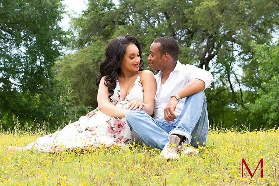 A couple sits closely together on the grass during a relaxed outdoor photo session in Austin, TX, surrounded by trees and natural greenery. The way they lean into each other shows quiet connection and comfort rather than stiff posing. This image reflects the natural, documentary approach used during family and couple photo shoots in Austin. The soft light and open space help create a calm, authentic moment. Sessions like this focus on real interaction instead of forced smiles.