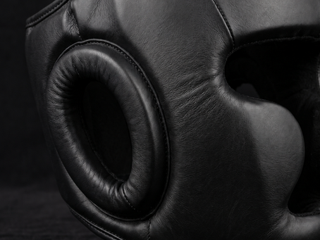 Close-up of finished black boxing headgear construction and stitching