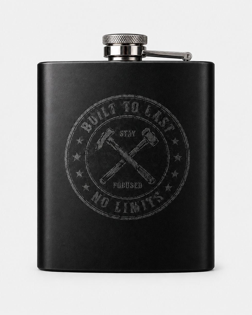 Back of black Built Different Flask with gold “Built to Last” and “Stay Focused” artwork.