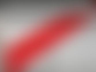 Seasonal homeowner securing empty home against flooding by applying protective tape to exterior door frame before departure