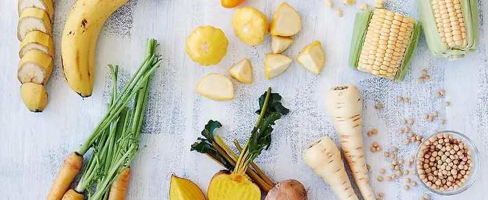 Healthy assortment of yellow foods.webp