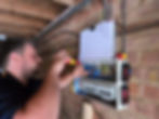 Adam inspecting and testing the fuse board in a residential property.