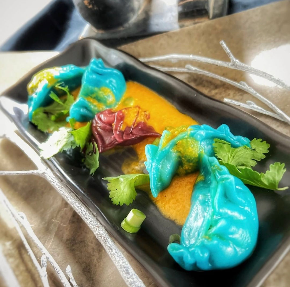 Brightly coloured Chinese dumplings on a plate