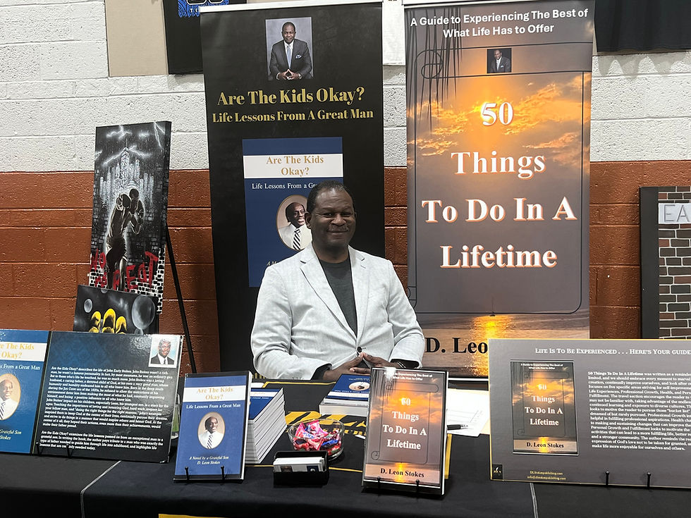Courtesy Photo: Author D. Leon Stokes poses during a book signing surrounded by displays featuring his two inspirational books, Are the Kids Okay? Life Lessons from a Great Man and 50 Things to Do in a Lifetime. Through his writing, Stokes encourages readers to embrace integrity, lifelong learning, personal growth, and purposeful living while sharing lessons inspired by his father and his own life experiences.