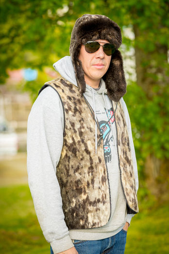 Jeremiah wearing a seal and sea otter Bomber hat and seal Vest
