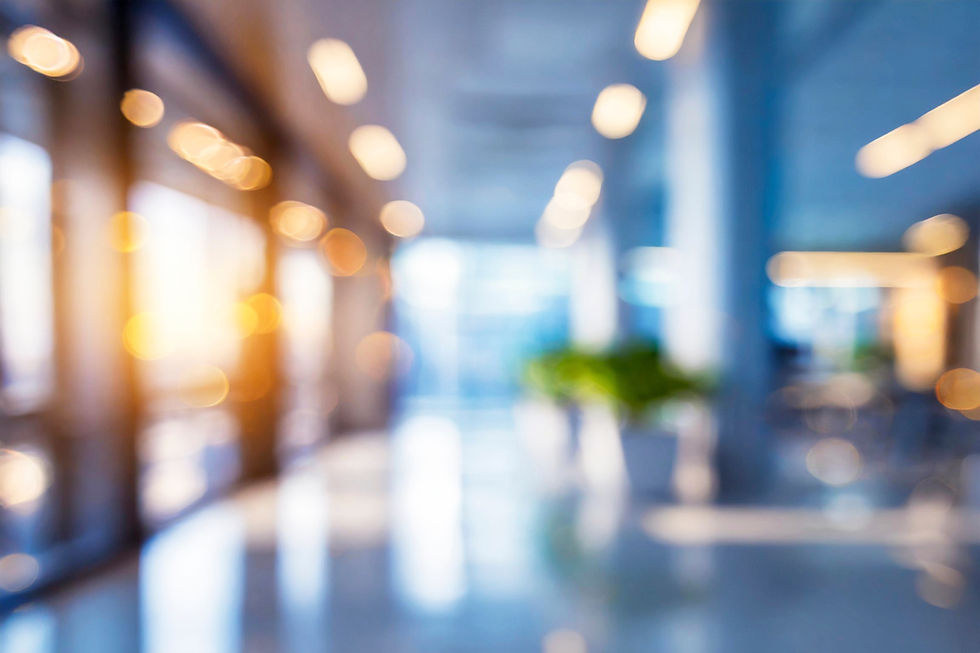 Blurred empty open space office. Abstract light bokeh at office interior background.jpg