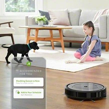 Thumbnail: Girl sitting, dog walking, a Roomba vacuuming, recommended features visible, in a home