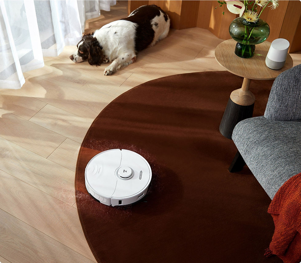 Miniatyrbild: White robot vacuum cleaning a red rug, dog resting nearby, ECOVACS GOAT GX-600.