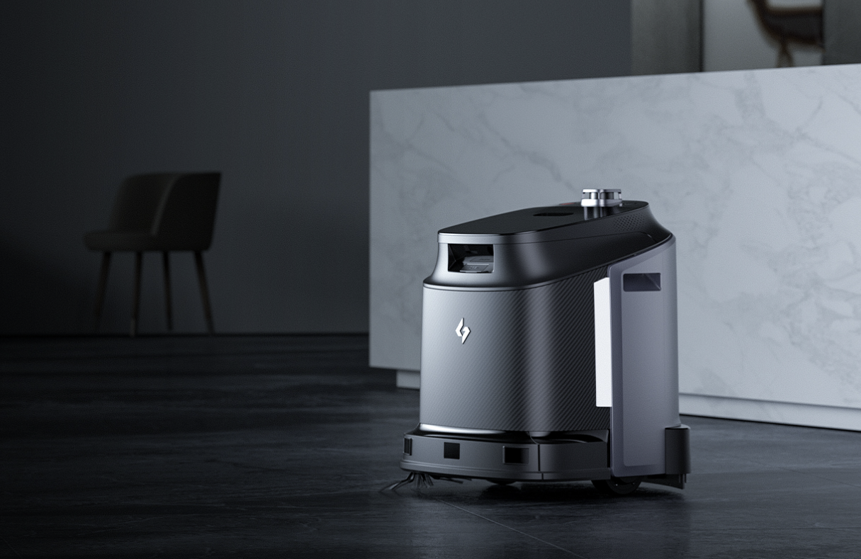 Black Narwal T10 robot vacuum cleaner on a clean floor near kitchen RAR