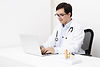 side-view-doctor-working-laptop (2).jpg