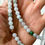 Thumbnail: This is a type A jadeite necklace with amber, white and green color.
