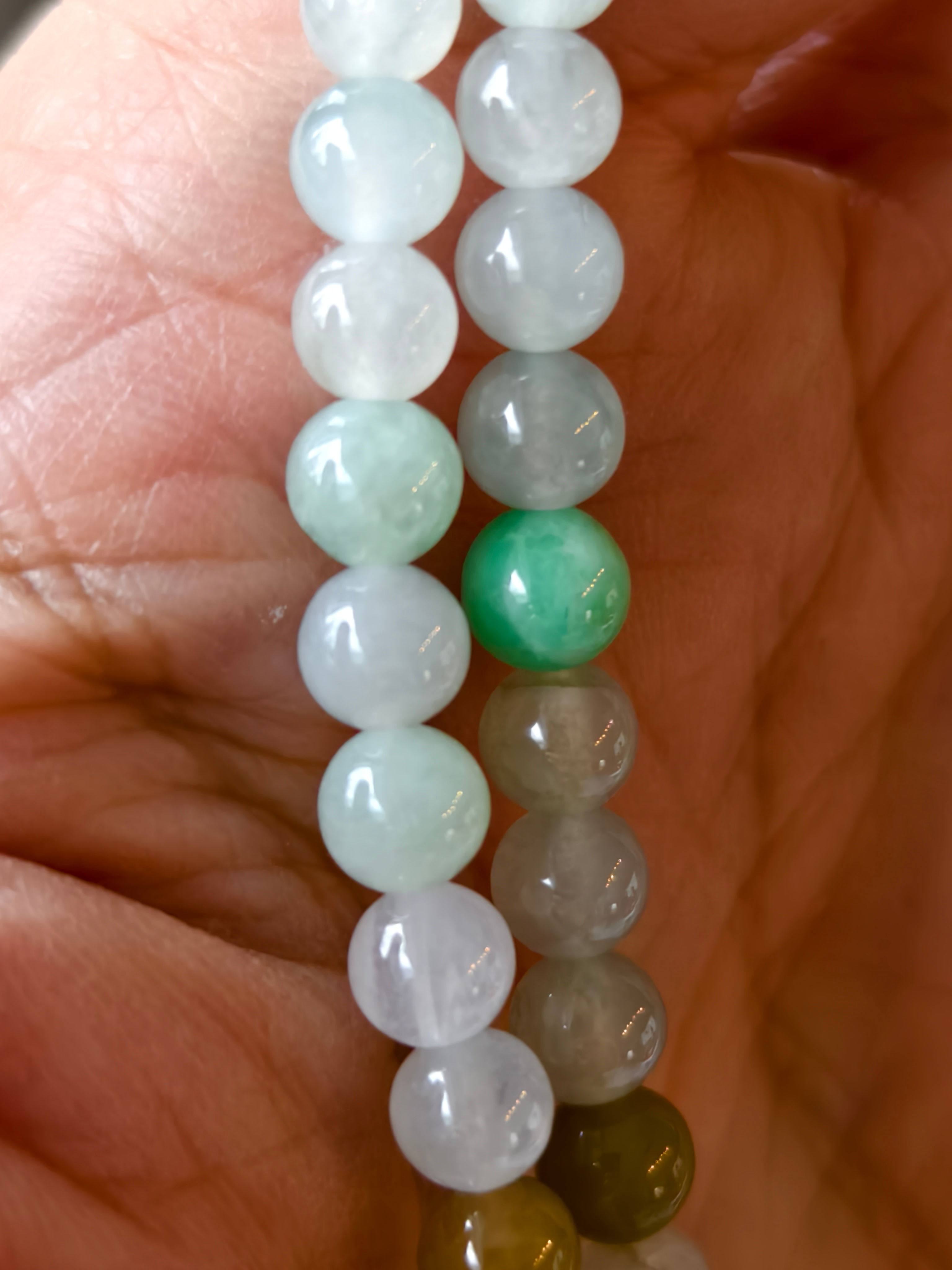 This is a type A jadeite necklace with mulitple color beads.