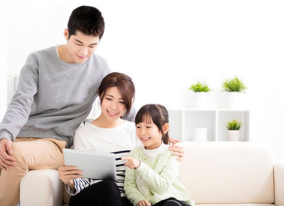 Happy-Attractive-Young--Family-watching-the-tablet-513591154_2035x1478.jpeg