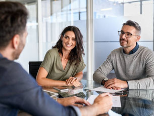 Couple discussing with advisor about what is a guarantor and guarantor meaning
