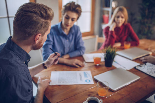 Group meeting to review a property plan and talk about ways to invest with friends.