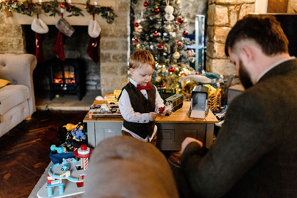 Groom getting ready at home with son Angus in the middle of the chaos