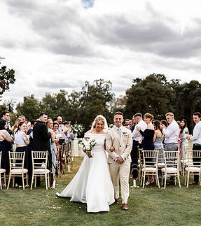 Emily and James-Burtonfields Hall wedding, the couple leave their ceremony.