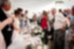 Singing waiters enterance durind a Farm Wedding