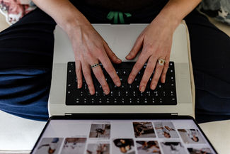 Hand on a keyboard during a branding photo session