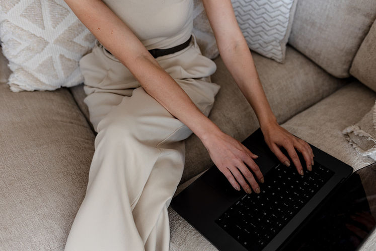 Detail shot of hands typing on a keyboard during a branding session