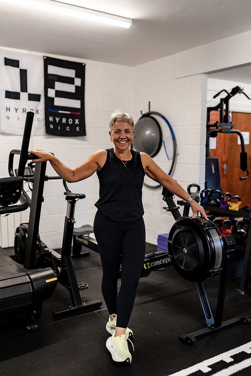 Angela from Fit Happens standing in her gym smiling during a branding photography session in Malton, North Yorkshire