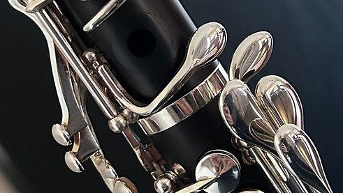 Close-up of a clarinet showing the extra left hand key