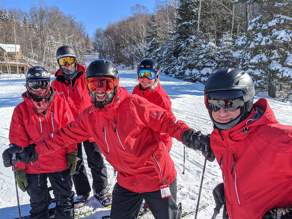 Instructors in red jackets during Snowhawks Programs.