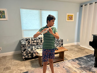 A 12 year old flutist learns his scales efficiently and masterfully.