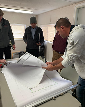 Rob Neidlinger looking at blueprints for personal care home