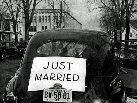 Rachel and Jim Herbst post in a car on their wedding day