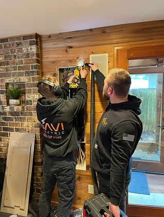 NAVI ELECTRIC employees performing a panel change in Kirkland, WA