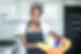 smiling-african-woman-holding-basket-600nw-1259897500.webp