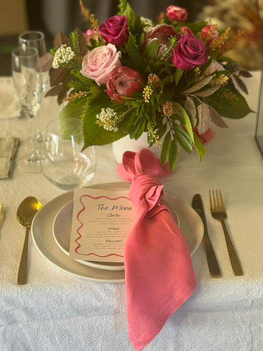 Pink rose floral centerpiece, table setting