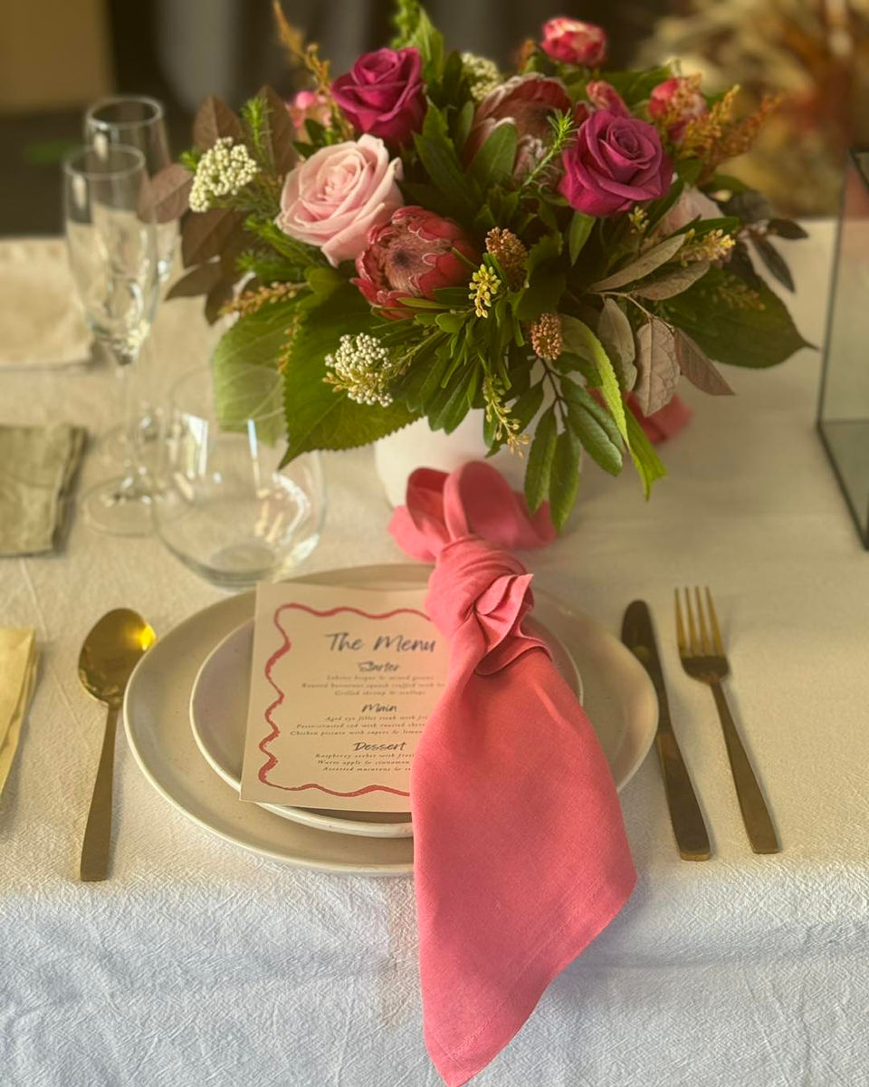 Pink rose floral centerpiece, table setting