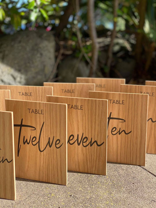 Wooden table number signs: Twelve, Eleven, Ten