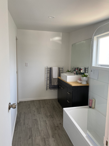 Modern bathroom with tub and vanity
