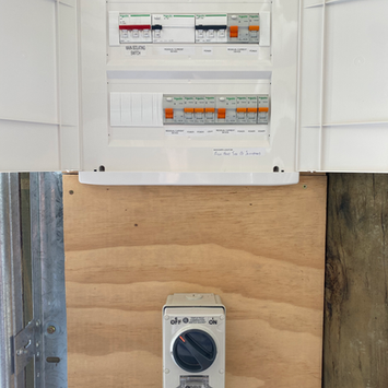 Circuit breaker box and rotary switch on wooden board