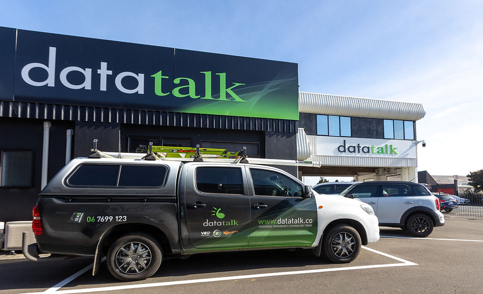 DataTalk branded service truck parked outside company building