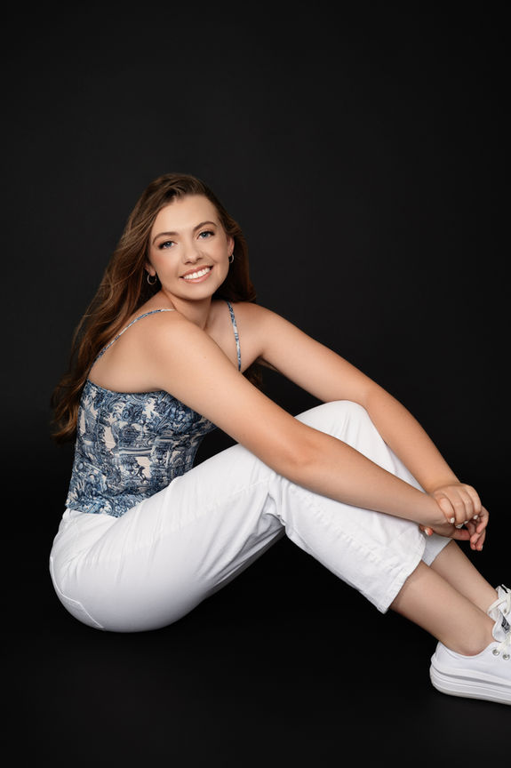 Senior student from Visalia California wearing white pants.